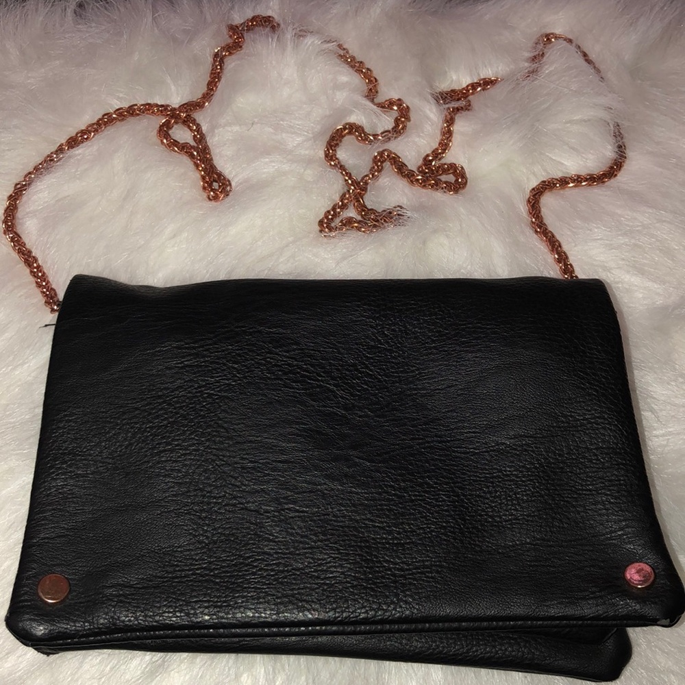 Black leather handbag with rose gold chain